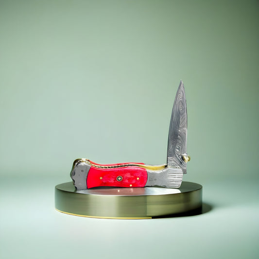 Artisan Folding Knife with Damascus Blade and Vibrant Red Handle