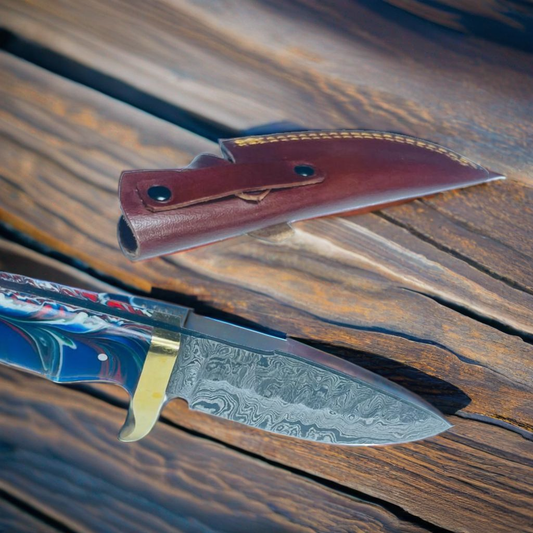 Handcrafted Damascus Steel Hunting Knife with Swirled Blue Resin Handle and Brass Guard